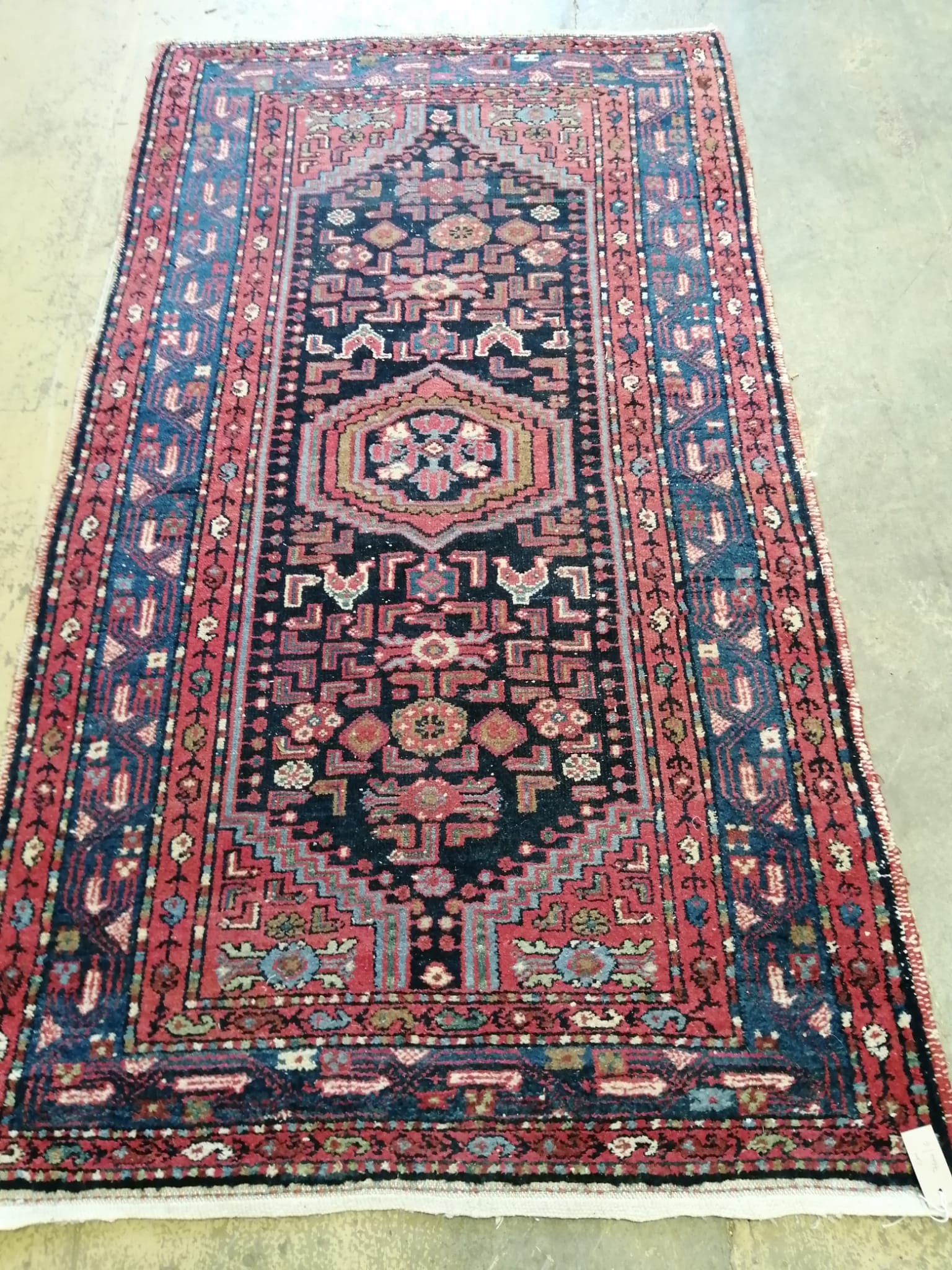 A Caucasian blue ground rug, 200 x 110cm